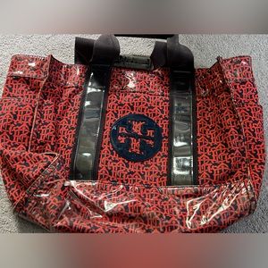 Tory Burch Worn Red and Royal Blue Pattern Canvas Tote bag with side pockets.
